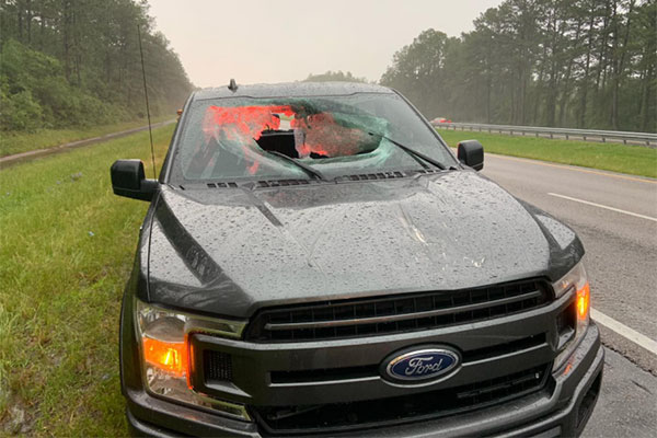 Lightning sends chunk of road flying into oncoming truck’s windshield