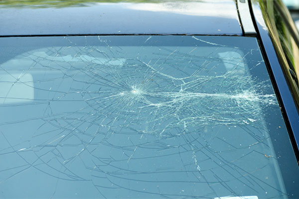 Is it legal to drive with a cracked windshield in MN?