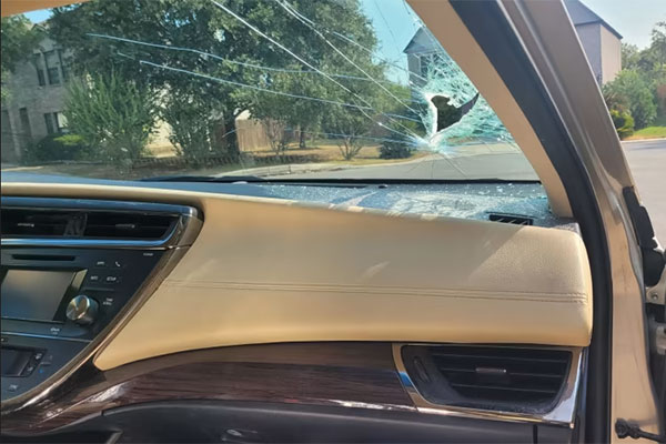 Woman escapes serious injury after spear pierces windshield